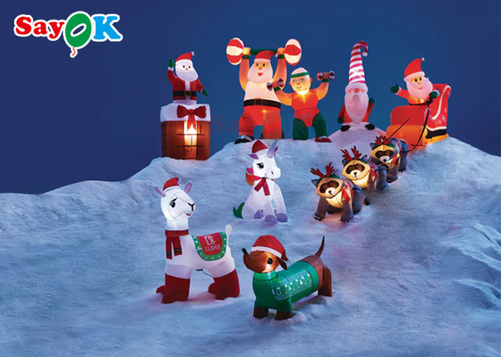 As decorações infláveis do Xmas do Natal gigante três guaxinins puxam Santa Claus To Give Gifts