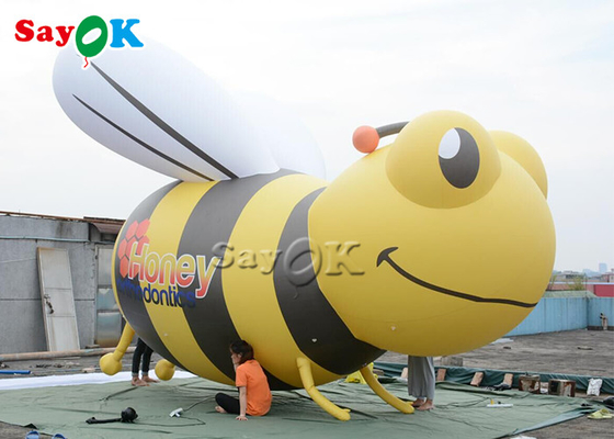 Abelhas infláveis gigantes feitas sob encomenda que anunciam o modelo estando dos desenhos animados